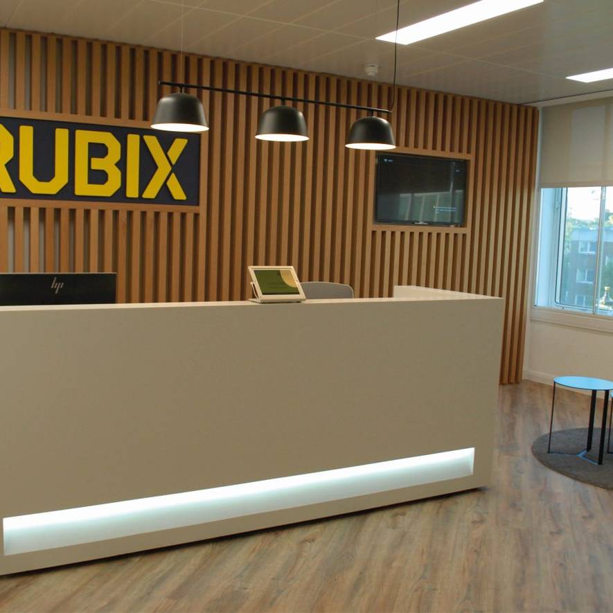 01 Rubix Reception desk with back wall company signage and timber clad feature wall