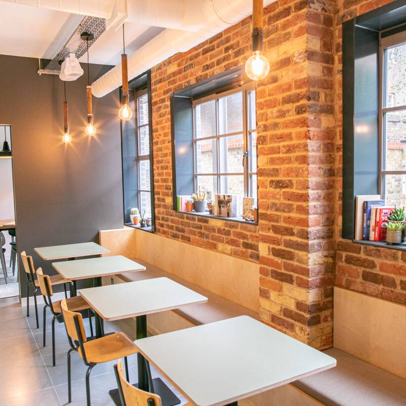 12 - X+WHY HP Units Clubhouse - Workplace kitchen breakout with built in banquette seating & Forbo furniture linoleum clad table tops