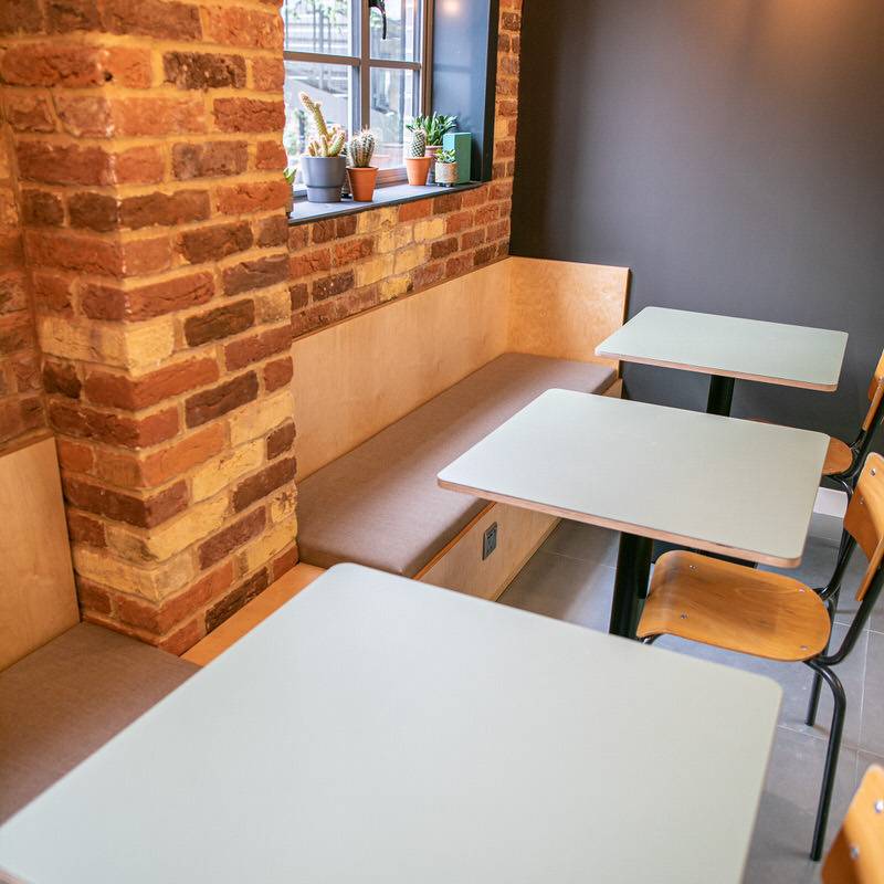 14 - X+WHY HP Units Clubhouse - Workplace kitchen breakout with built in banquette seating & Forbo furniture linoleum clad table tops